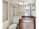 Bathroom featuring granite countertop, a large mirror, and shower at 609 S Glen Ave # E, Tampa, FL 33609