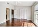 Bedroom featuring hardwood floors, ceiling fan, closet, and natural light at 609 S Glen Ave # E, Tampa, FL 33609
