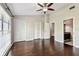 Spacious bedroom with hardwood floors, ceiling fan, and closet at 609 S Glen Ave # E, Tampa, FL 33609