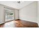 Sun-filled bedroom with hardwood floors and large window at 609 S Glen Ave # E, Tampa, FL 33609