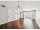 Dining area featuring hardwood floors and view into the living area at 609 S Glen Ave # E, Tampa, FL 33609
