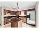 Spacious kitchen features an island, stainless steel refrigerator, and modern appliances at 609 S Glen Ave # E, Tampa, FL 33609