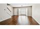 View of the living room with beautiful hardwood floors and a bay window at 609 S Glen Ave # E, Tampa, FL 33609