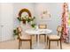 Bright dining area featuring a round table with modern chairs and decorative accents at 1079 Signet, Apollo Beach, FL 33572