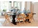 Elegant dining room with modern lighting, a large dining table, and seating for six at 1079 Signet, Apollo Beach, FL 33572