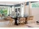 Elegant dining room with modern lighting, a large dining table, and seating for six at 1079 Signet, Apollo Beach, FL 33572