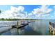 A private dock with several kayaks sits on a serene lake offering a relaxing outdoor experience at 1079 Signet, Apollo Beach, FL 33572