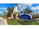 Community entrance sign amid lush landscaping and a decorative structure at 1079 Signet, Apollo Beach, FL 33572