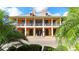 A grand building featuring multiple windows, balconies and lush tropical foliage at 1079 Signet, Apollo Beach, FL 33572