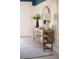 Hallway table with lamp, decorative vase and a round mirror at 1079 Signet, Apollo Beach, FL 33572
