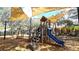 Community playground with a sun shade, slide, climbing bars, and other amenities for Gathering fun at 1079 Signet, Apollo Beach, FL 33572