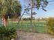 Backyard view of the recreational field and parking lot, as seen behind chain link fence at 3680 Whiting Se Dr, St Petersburg, FL 33705