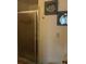 Bathroom featuring glass shower, white walls with artwork, and an outlet at 3680 Whiting Se Dr, St Petersburg, FL 33705
