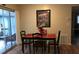 A modern dining room featuring a wooden table and chairs with a view to the outside at 3680 Whiting Se Dr, St Petersburg, FL 33705