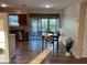 Cozy dining area adjacent to the kitchen with natural light and wood-look floors at 3680 Whiting Se Dr, St Petersburg, FL 33705