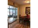 Cozy dining area with wood floors and sliding glass doors to the sunroom at 3680 Whiting Se Dr, St Petersburg, FL 33705