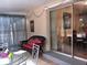 Enclosed Florida Room with sliding glass door leading to dining room and wicker seating at 3680 Whiting Se Dr, St Petersburg, FL 33705