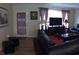 Comfortable living room with ample seating and natural light from windows and door at 3680 Whiting Se Dr, St Petersburg, FL 33705