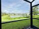 Enjoy the beautiful water view from this screened-in patio and lush green backyard at 4171 Via Sienna Cir, Sarasota, FL 34243