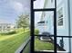 Enjoy the lovely view from the screened in lanai that overlooks the backyard and water at 4171 Via Sienna Cir, Sarasota, FL 34243