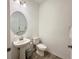 Well-lit powder room features a modern vanity with a stylish mirror and fixtures at 4171 Via Sienna Cir, Sarasota, FL 34243
