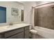 Well-lit bathroom featuring a gray vanity, quartz countertop, tub, and shower combination at 4171 Via Sienna Cir, Sarasota, FL 34243