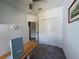 Bedroom featuring a carpet, ceiling fan, bi-fold closet, and a wooden desk at 4171 Via Sienna Cir, Sarasota, FL 34243