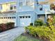 Charming two-story home with a private residence sign, beautiful garden, and a two-car garage at 4171 Via Sienna Cir, Sarasota, FL 34243