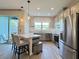 Modern kitchen with stainless steel appliances, a breakfast bar, and an open layout perfect for entertaining at 4171 Via Sienna Cir, Sarasota, FL 34243