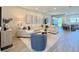 Inviting living room with comfortable seating, modern decor, and an open layout connecting to the dining area at 4171 Via Sienna Cir, Sarasota, FL 34243