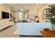 Spacious living room featuring a staircase, ample seating, and stylish decor with natural light at 4171 Via Sienna Cir, Sarasota, FL 34243