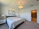 Comfortable main bedroom featuring neutral tones, a view to the bathroom, and ample natural light at 4171 Via Sienna Cir, Sarasota, FL 34243