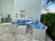 Comfortable seating area at the community pool house with pool rules and a water fountain at 4171 Via Sienna Cir, Sarasota, FL 34243
