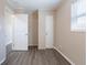 Bedroom with a window, neutral walls, wood-look floors, and a closet at 3850 11Th S Ave, St Petersburg, FL 33711