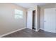 Bedroom with wood-look flooring, neutral walls, and a sliding closet door at 3850 11Th S Ave, St Petersburg, FL 33711