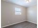 Bedroom featuring a bright window, neutral paint, and wood-look flooring at 3850 11Th S Ave, St Petersburg, FL 33711