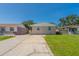 Charming single-story home with a well-manicured lawn and a spacious driveway at 3850 11Th S Ave, St Petersburg, FL 33711