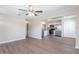 Open-concept living space with hardwood floors flowing into a modern, stylish kitchen at 3850 11Th S Ave, St Petersburg, FL 33711