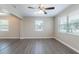 Spacious living room featuring hardwood flooring and abundant natural light through large windows at 3850 11Th S Ave, St Petersburg, FL 33711