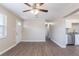 Bright open floorplan with hardwood flooring connects living room and modern kitchen at 3850 11Th S Ave, St Petersburg, FL 33711