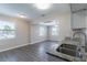 Bright living room with wood-look flooring and large windows at 3850 11Th S Ave, St Petersburg, FL 33711