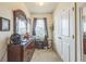 Bedroom featuring a dresser with mirror, window, and closet doors at 819 Lucent Sands Ct, Brandon, FL 33511