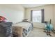 Bright bedroom with window view, neutral carpet, and comfortable sleeping space at 819 Lucent Sands Ct, Brandon, FL 33511