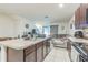 Open kitchen and living area with an island, ideal for entertaining at 819 Lucent Sands Ct, Brandon, FL 33511