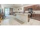 Open kitchen and living area with an island, ideal for entertaining at 819 Lucent Sands Ct, Brandon, FL 33511