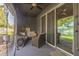 Relaxing screened-in porch with comfortable seating and a ceiling fan at 819 Lucent Sands Ct, Brandon, FL 33511