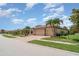Stunning house with a 3-car garage, brick driveway and lush landscaping at 20323 Granlago Dr, Venice, FL 34293