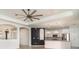 Open-concept space with white cabinets, stainless steel appliances and a pool view at 20323 Granlago Dr, Venice, FL 34293