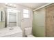 Bright bathroom featuring white sink, toilet, and shower with framed glass doors at 1001 Meadowcrest Dr, Valrico, FL 33594