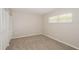 Bedroom featuring carpet, white trim, and window with mini blinds at 1001 Meadowcrest Dr, Valrico, FL 33594